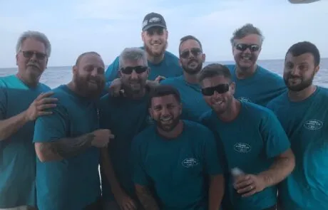 Wanex team holding the catch